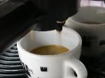 The final shot into the ceramic cup.